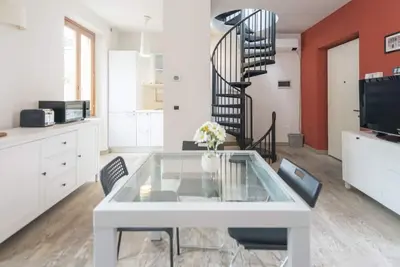 Welcome to this shining three levels apartment located in the heart of Navigli City Centre of Milan