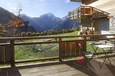 Image de Chalet, vue montagne, terrasse, balcon, cheminée ou poêle à bois, parking, télévision, 162m²