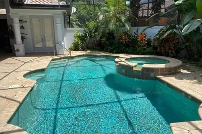 Image de Updated home with pool, spa and lots of privacy in Pelican Landing community.