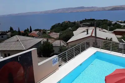 Image de Appartement de vacances avec vue sur la mer, climatisation et piscine