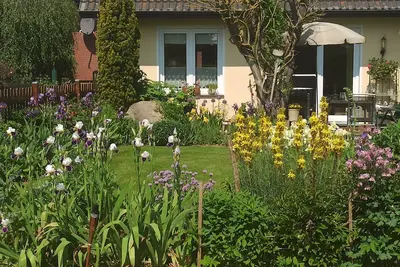 Image de Holiday home in a beautiful garden, near the Baltic Sea and the state capital