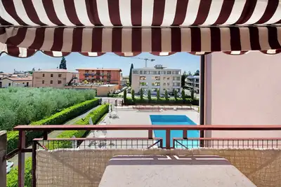 Image de Appartement \"Résidence San Zeno S P House\" avec piscine partagée, terrasse et A/C