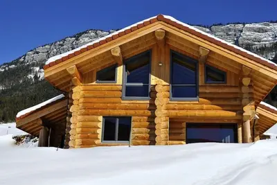 Image de Chalet neuf en rondins de bois 4* 10\/12 personnes en Montagne Wifi Jacuzzi