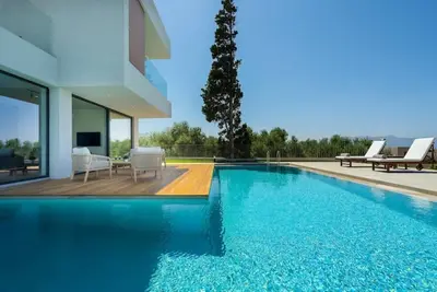 Image de Ostria, Pirgos-villas, Ηeated pool, amazing sea view