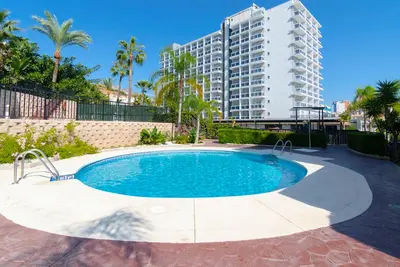 Image de Appartement de vacances \"Los patos 2 bajo\" avec vue sur les montagnes et piscine partagée.