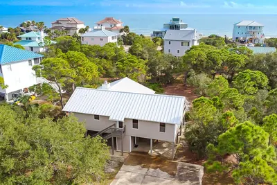 Image de Charming cottage, walk to Gulf with shared pools, hot tub, & central Ac