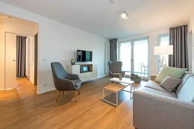 Image de Top Apartment in Strandnähe mit Loggia, Strandkorb, Zwei Bädern & Sauna im Haus!