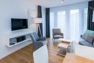 Image de Strandnahes Apartment mit Terrasse Inkl. Parkplatz, Schwimmbad- & Saunanutzung