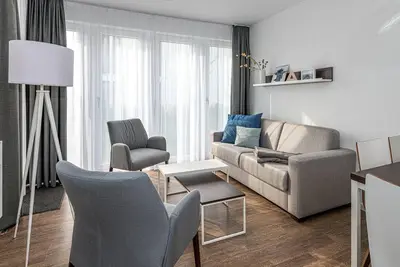 Image de Strandnahes Ferienapartment mit Terrasse, Parkplatz, Schwimmbad- & Saunanutzung