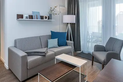 Image de Strandnahes Ferienapartment mit Balkonen, Parkplatz, Schwimmbad- & Saunanutzung
