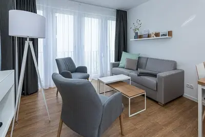 Image de Strandnahes Ferienapartment mit Balkon, Parkplatz, Schwimmbad- & Saunanutzung