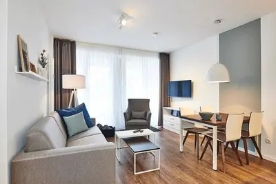 Image de Strandnahes Apartment mit Zwei Terrassen Inkl. Freier Schwimmbad- & Saunanutzung