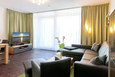 Image de Hochwertiges Familienapartment mit Großem Balkon, Whirlbadewanne und Kaminofen