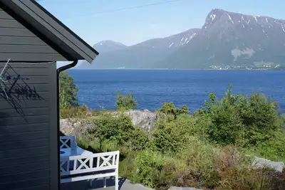 Holiday home with view plot beyond Fjord and mountains.