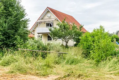 Image de Appartement \"Beutenmühle Straussenfarm Dach\" avec jardin et balcon partagés.