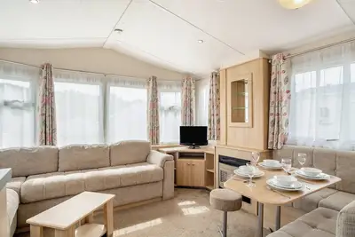 Image de 12ft-wide luxury caravan with one double and one twin.