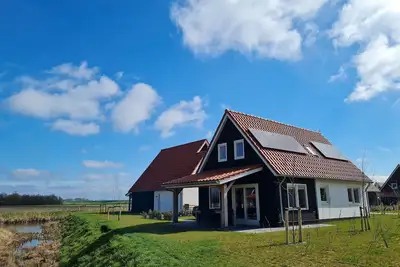 Image de Maison de vacances moderne à Scherpenisse avec terrasse