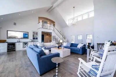 Image de Luxury lakefront home w/ heated saltwater pool, cabana at top of beach stairs