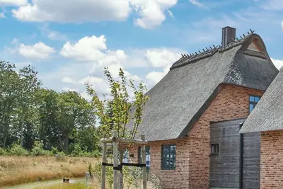 Image de Malerhaus Leuchtturm, the thatched-roof semi-detached house for 4-5 people & beautiful Wildwie