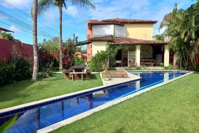 Image de Casa com quatro suĂtes, piscina e churrasqueira