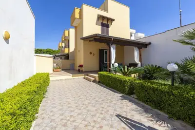Image de Comfortable villa a few meters from the sea of ​​Porto Cesareo with garden, equipped veranda and Bbq