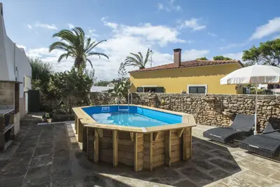 Image de Typical Menorcan house steps from the beach. Pool, garden, barbecue and fireplace