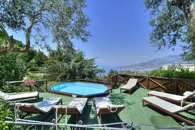 Villa Silene: A welcoming three-story villa located on a hillside, facing the sea.