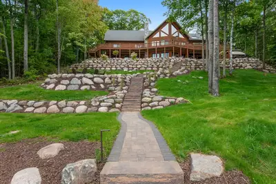 Image de Lakefront estate with 3-story chalet & guest house - hot tub, game room, and gym