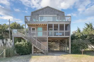 Image de Semi-oceanfront home in Avon featuring 4 bedrooms and ocean views, just steps from the beach.