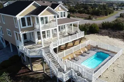 Image de Enjoy panoramic views in “Breezy Point, ” a five-bedroom home with a private pool in Dunescape.