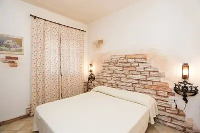 Image de Maison de vacances \"La Casa dell'Olivastro\" avec terrasse privée et Wi-Fi