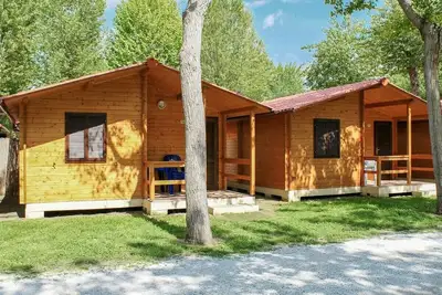 Beautiful wooden house with veranda and close to the beach.