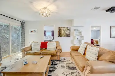 Riverside escape with a scenic deck, grill, firepit & central Ac - dog-friendly