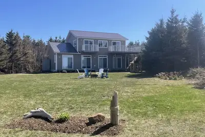 Large beach house with cottage feel, with ocean views and steps from sandy beach