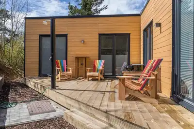 Image de Maison de vacances \"Tiny House Brekendorf Kammberg\" avec vue sur les montagnes & Wi-Fi