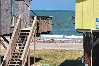 Just a few steps the the ocean from this second row home!
