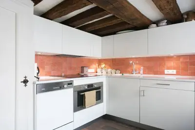 Image de In A Building Of The 17th Century With Exposed Wooden Beams- Secret Marais