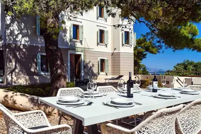 A beachfront villa with a sauna and a gym