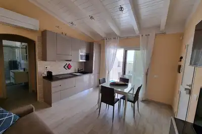 Image de Appartement 'Spargi' avec terrasse privée, Wi-Fi et climatisation.
