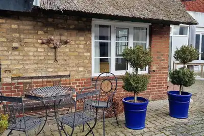 Image de Welcome to this unique historic thatched-roof cottage in the village center v