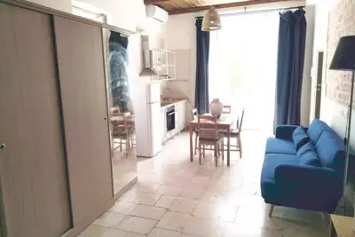 Image de San Giorgio furnished suite surrounded by greenery.