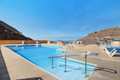 Image de Appartement de vacances 'Paraíso Taurito' avec vue sur la mer, terrasse, piscine partagée et Wi-Fi