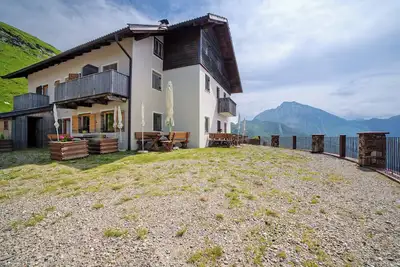 Image de Maison de vacances \"Enzianhuette\" avec vue sur la montagne, 3 balcons et terrasse partagée