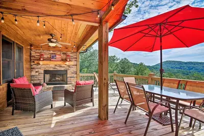 Image de With stunning mountain views, Altitude Adjustment invites pets to enjoy its charm, featuring a hot tub, double outdoor fireplace, & WiFi