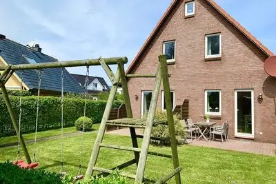 Image de 150m to the beach with private beach chair, south-facing garden, Wlan, Sauna, barbecue, handcart