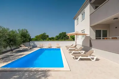 Appartement de vacances avec piscine à usage commun