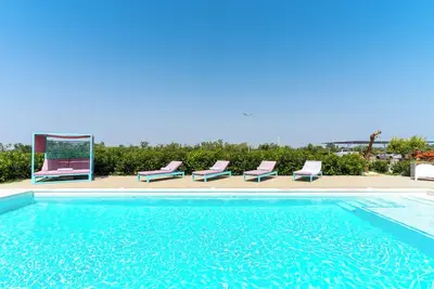 Image de Appartement de vacances \"Le Scuderie 4\" avec piscine partagée, terrasse partagée et Wi-Fi