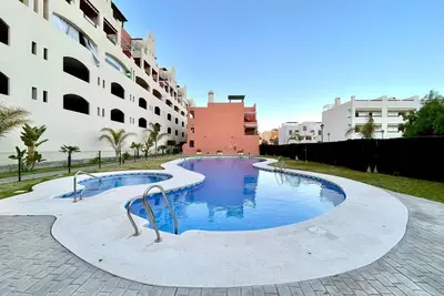 Image de Appartement avec piscine commune près de la plage