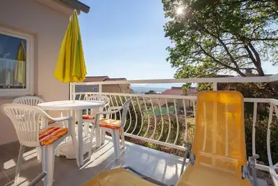 Image de Appartement pour 4 personnes avec parking privé et vue mer
