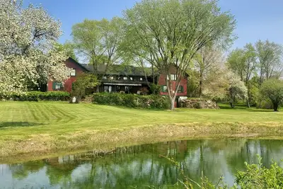 Image de The Old Orchard Home surrounded by a small apple orchard, large meadows, and a private pond